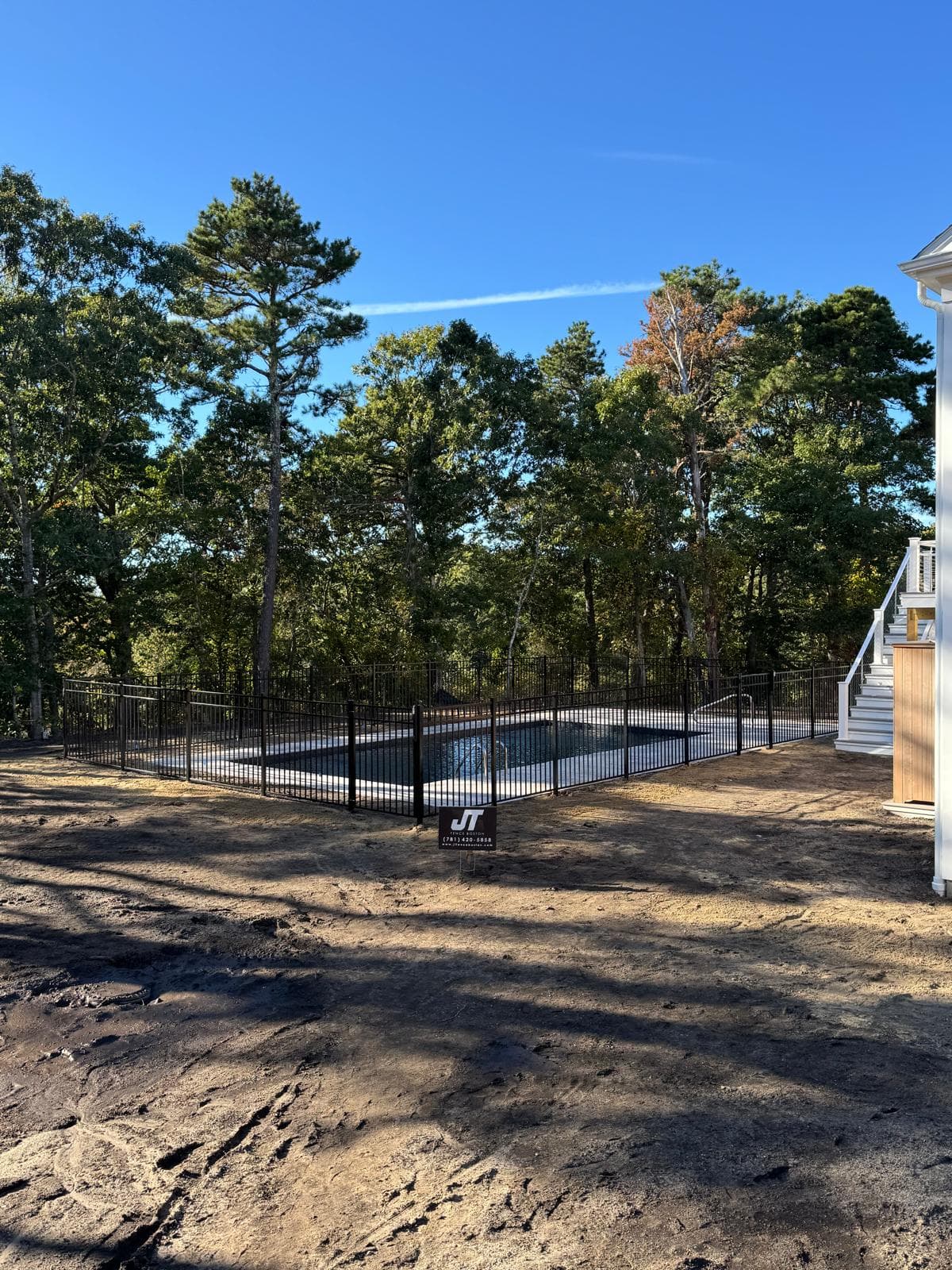 Another angle of pool fence with JT Fence sign