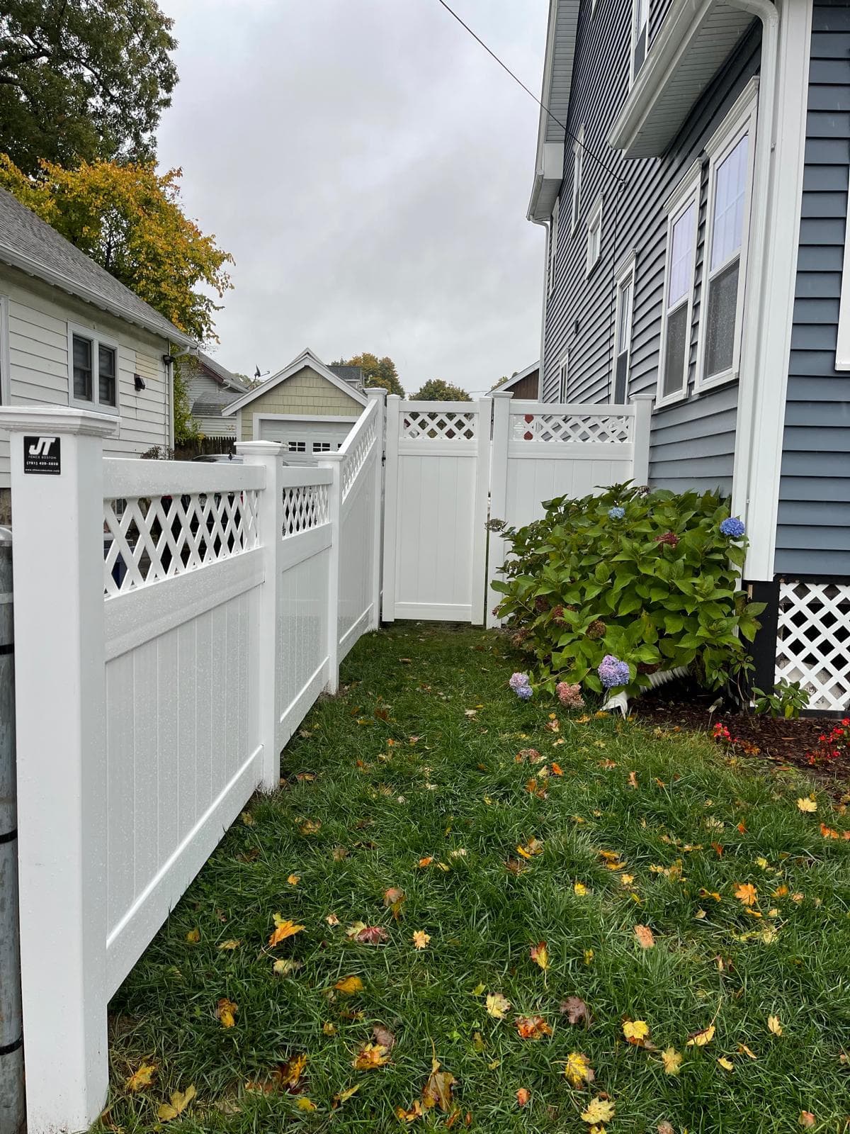 White vinyl semi-privacy fence with lattice top