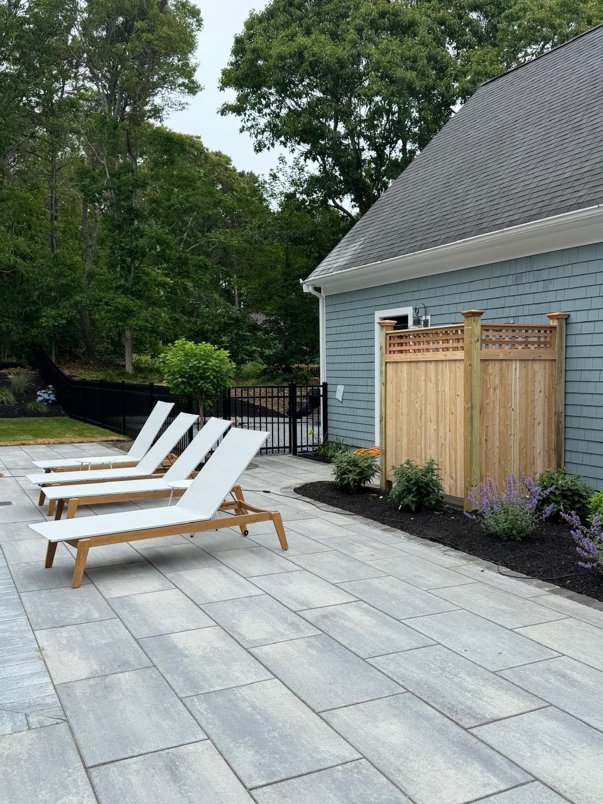 Modern vertical picket aluminum fence with even spacing for security and curb appeal