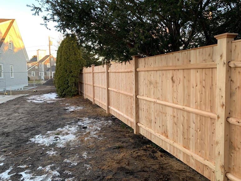 Solid wood privacy fencing for backyard screening — JT Fence installation in Massachusetts