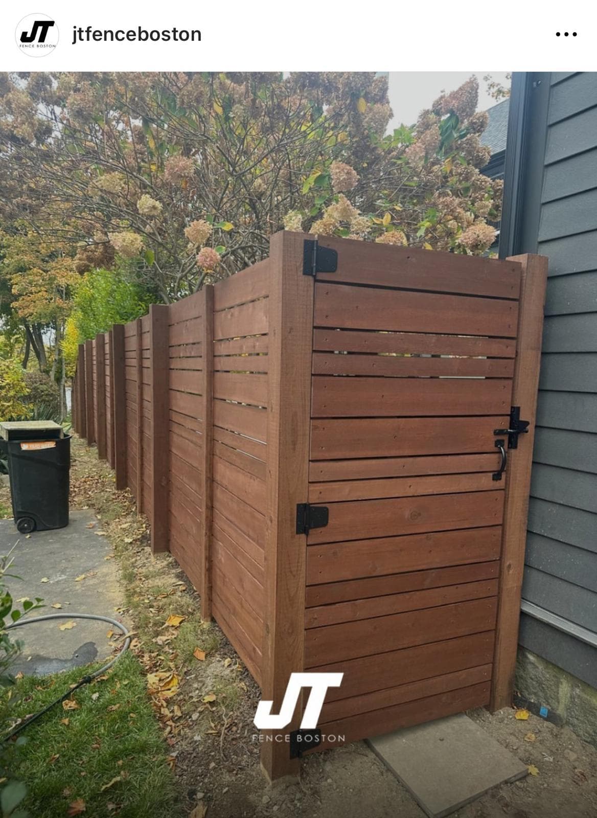 Dark stained horizontal wood fence with gate, JT Fence Boston branded